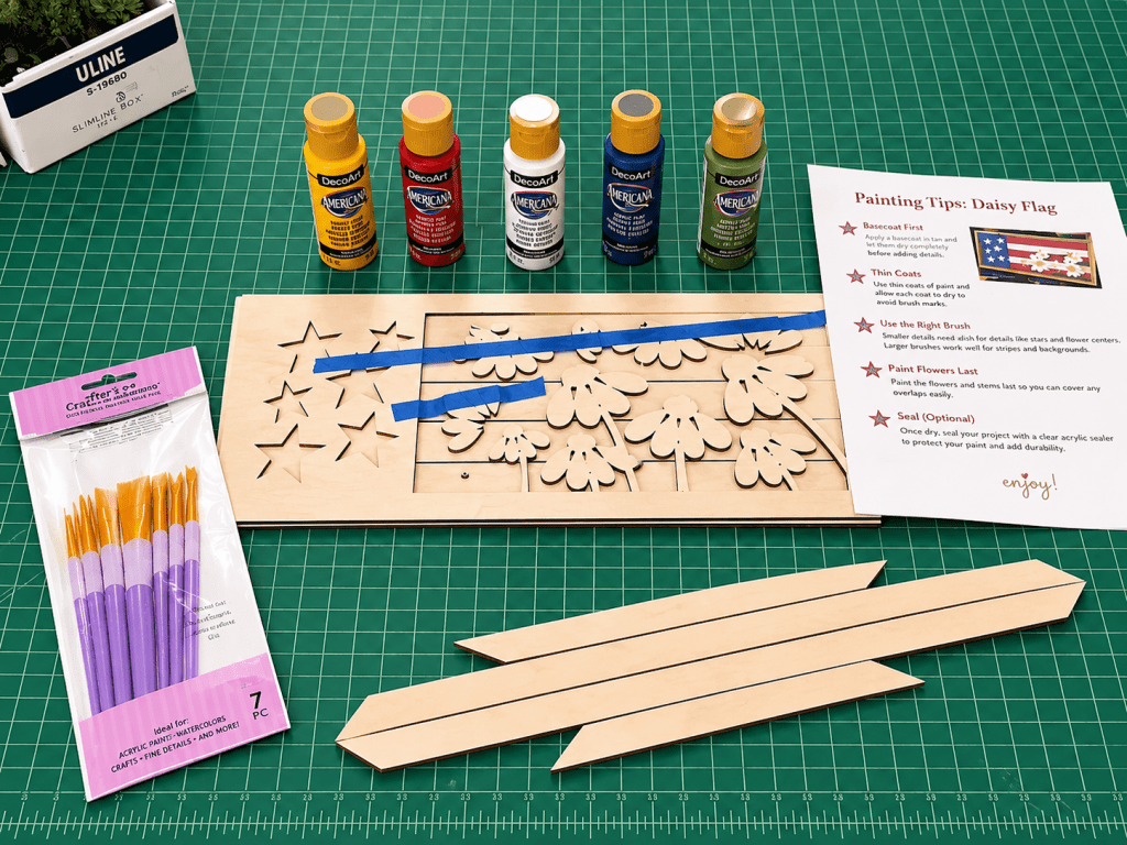 Supplies needed to paint daisy flag.  Paint, paint brushes, wood kit and instructions.